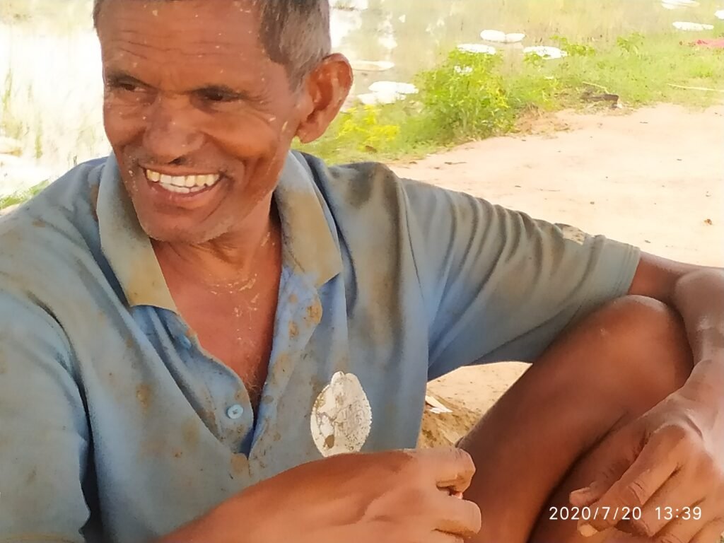 A person smiling for the cameraDescription automatically generated